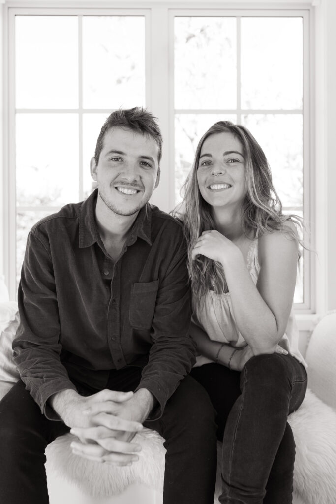Joel and Bonita, Northland wedding photographers, smiling together in their studio