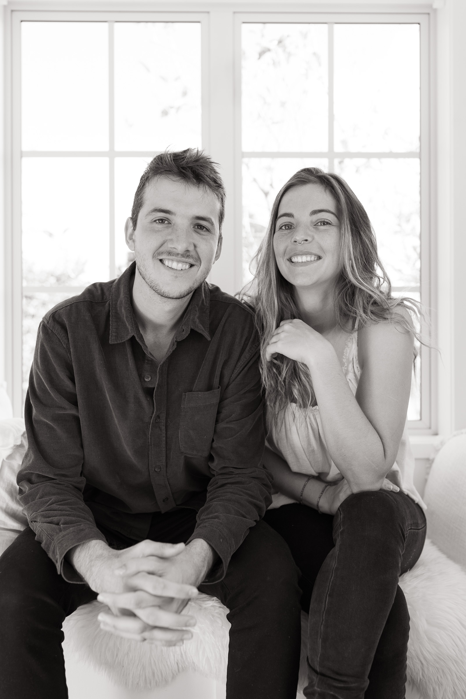 Joel and Bonita, Northland wedding photographers, smiling together in their studio