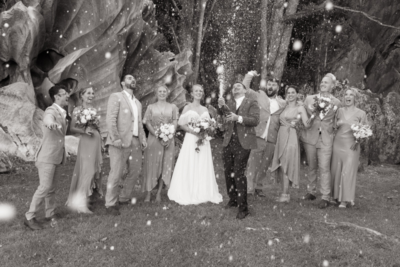 Bridal party spraying champagne at St Clair Farm wedding venue in Whangārei, Northland