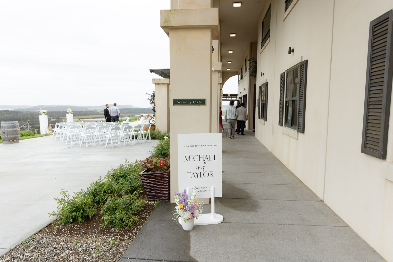 Outdoor wedding ceremony setup beside the winery building at Carrington Estate overlooking the Karikari Peninsula.